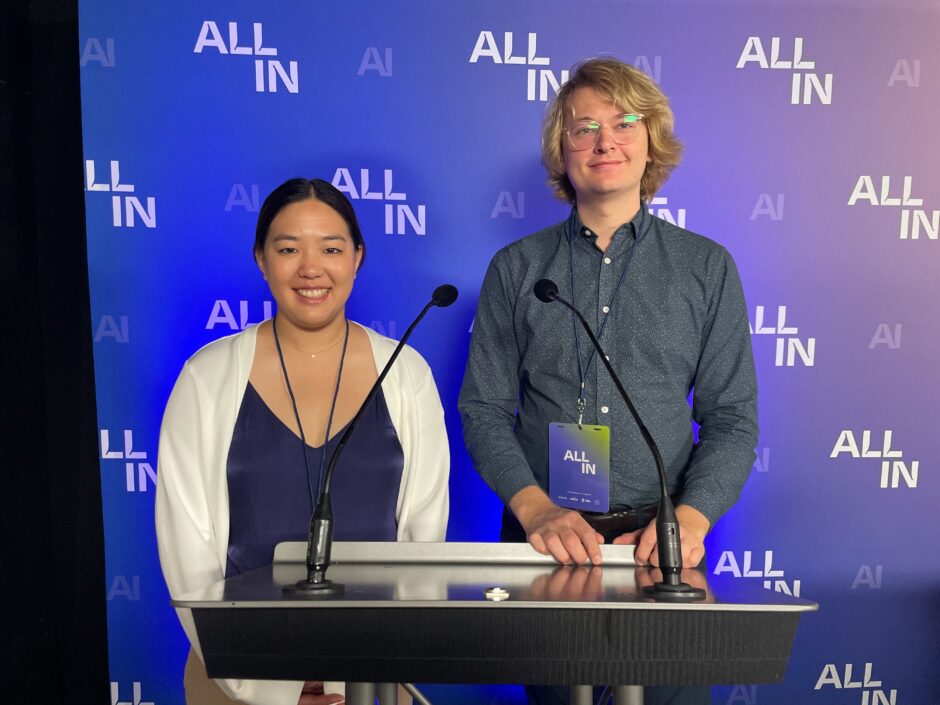 Coastal Carbon co-founders Kelly Zheng and Thomas Storwick stand in front of podium.