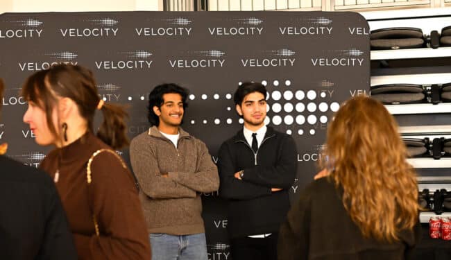 University of Waterloo students pose in front of Velocity banner