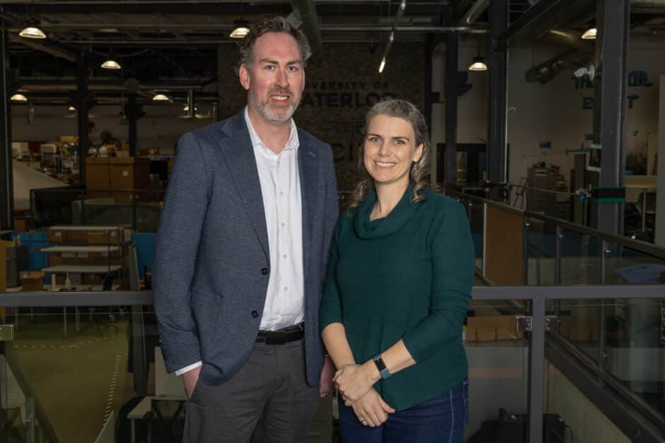 On the left: Dr. Michael Pope, co-founder and chief science officer of Evercloak. On the right is Evelyn Allen, CEO and co-founder. They are in standing in the Velocity incubator with the University of Waterloo and Velocity logos in the background.